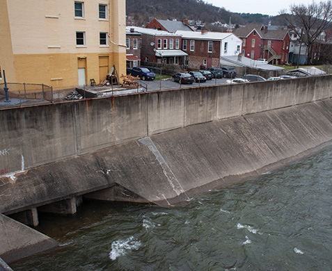 Wills Creek starts out as a full-fledged stream of the Potomac, but is contained in a concrete flood control structure as it passes through Cumberland, MD. Here it’s a river surrounded by concrete. Photograph, Nicole Lehming