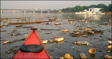trash in the Anacostia River by Skip Brown
