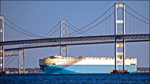 Cargo ship going under the Bay Bridge by Michael W. Fincham